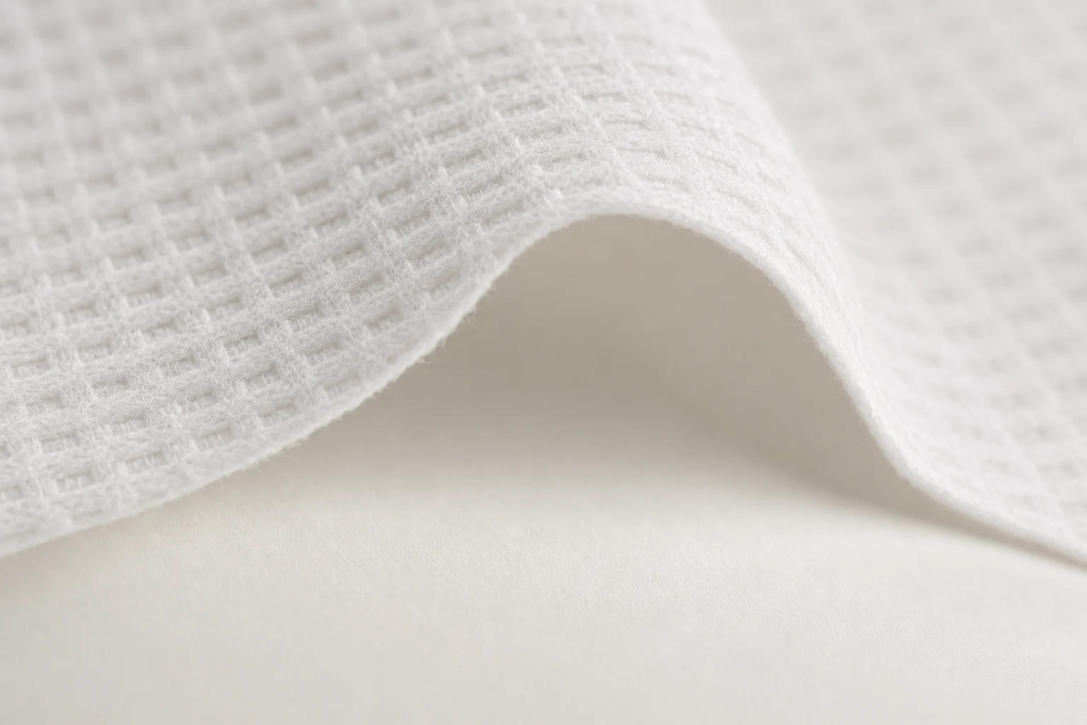 A close look at the white fibers and folded texture of a Lyocell towel